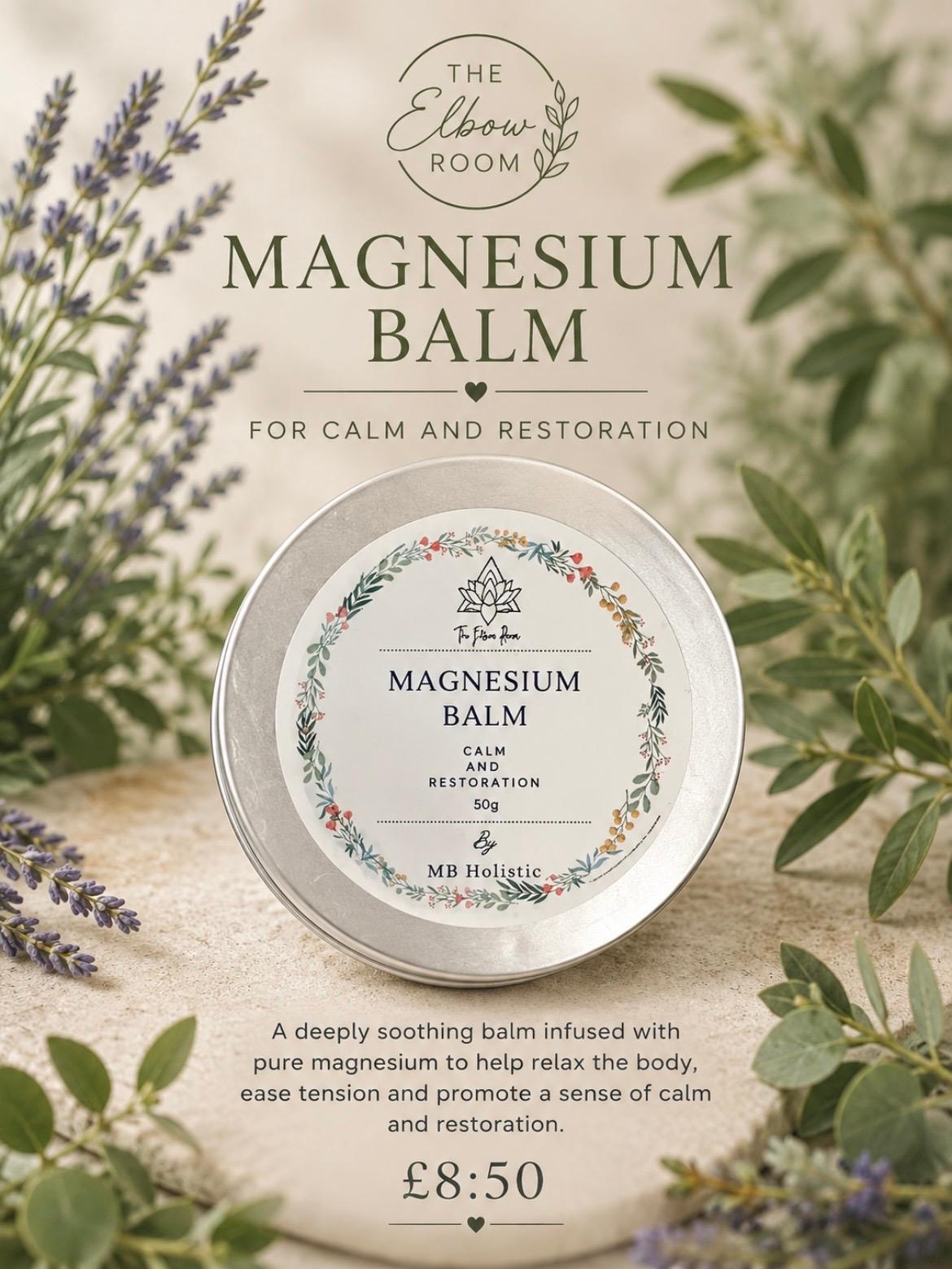 Magnesium Balm tin surrounded by lavender sprigs on soft light sand